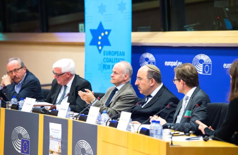 ECI director Tomas Sandell applauds after a speech at his organization's policy conference in the European Parliament last week (photo credit: ECI)