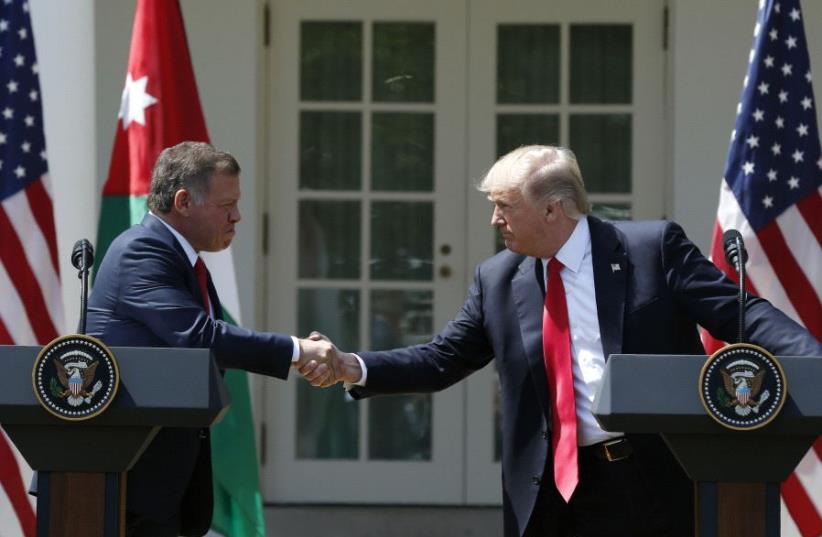 US President Trump greets Jordan's King Abdullah II during joint news conference at the White House (photo credit: REUTERS)
