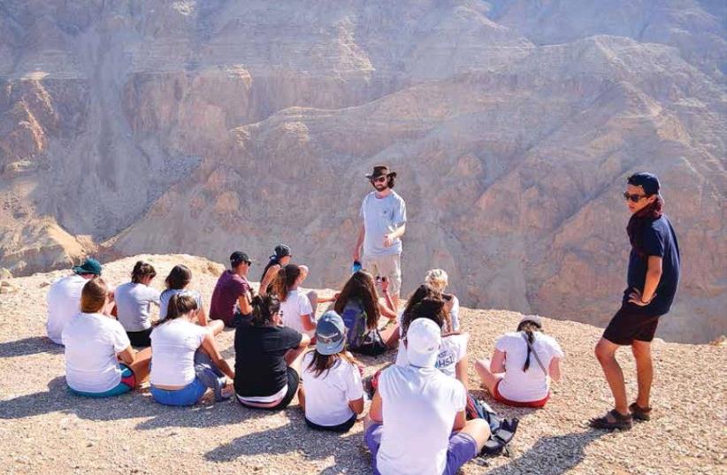 Alexander Muss High School in Israel (AMHSI) students learn about the history of Masada on-site(AMHSI) students learn about the history of Masada on-site (photo credit: AMHSI-JNF)