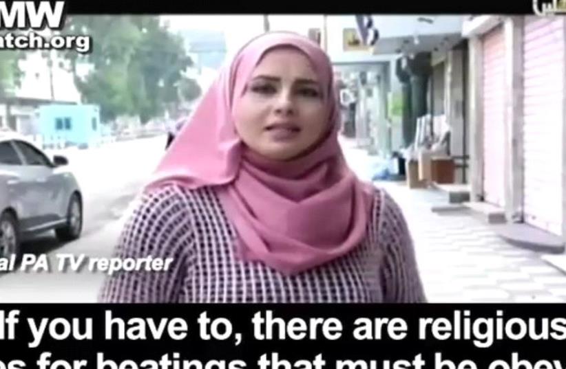 PA TV reporter advising viewers to beat their wives (photo credit: PALESTINIAN MEDIA WATCH)