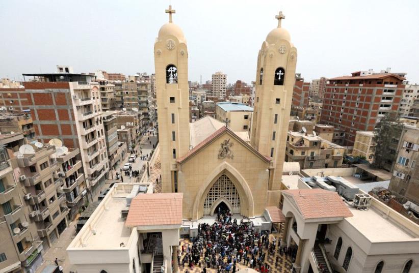 Egyptians gather in front of a Coptic church that was bombed on Sunday in Tanta, Egypt, April 9, 2017 (photo credit: REUTERS)
