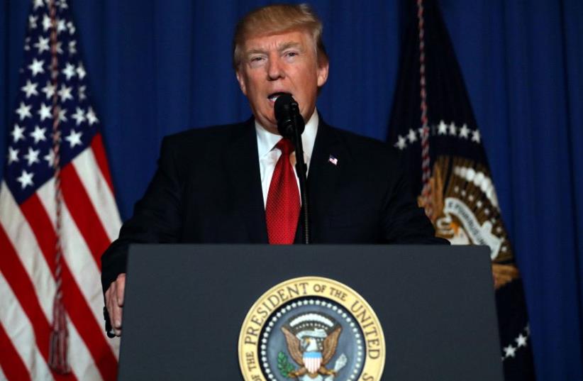 US President Donald Trump delivers an statement about missile strikes on a Syrian airbase, at his Mar-a-Lago estate in West Palm Beach, Florida, US, April 6, 2017.  (photo credit: REUTERS)