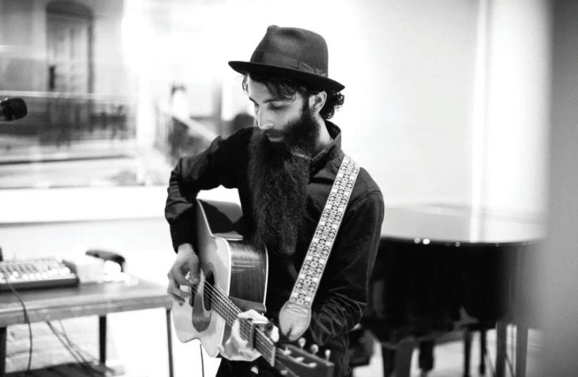 ‘I LIKE to find a way of singing the ordinary as something extraordinary: the parts in everyday life that you might pass by or maybe never think about,’ says hassidic folk singer Levi Robin.  (photo credit: 424 ARTIST MANAGEMENT)