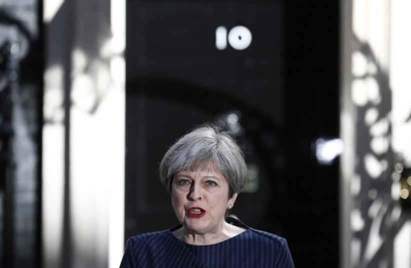 Britain's Prime Minister Theresa May speaks to the media outside 10 Downing Street, in central London, Britain April 18, 2017 (photo credit: REUTERS)