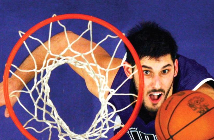 Israel national team and Minnesota Timberwolves forward Omri Casspi took part in Basketball Without Borders Europe as a player in 2005 and will do so as a guide this year, with the camp to be held at The Wingate Institute in Netanya during August, the first time the event will take place in Israel. (photo credit: REUTERS)