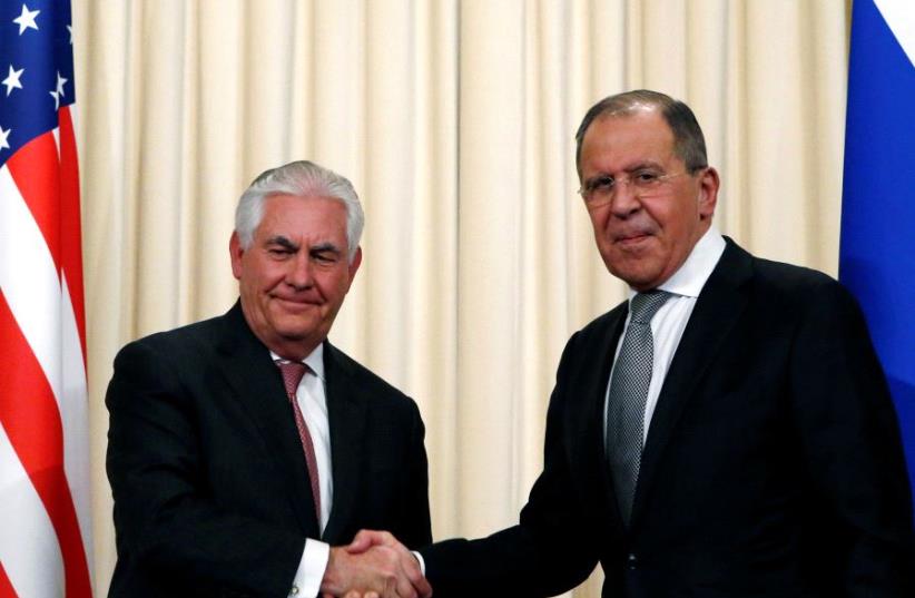 Russian Foreign Minister Sergei Lavrov shakes hands with US Secretary of State Rex Tillerson during a news conference following their talks in Moscow, Russia, April 12, 2017. (photo credit: REUTERS)