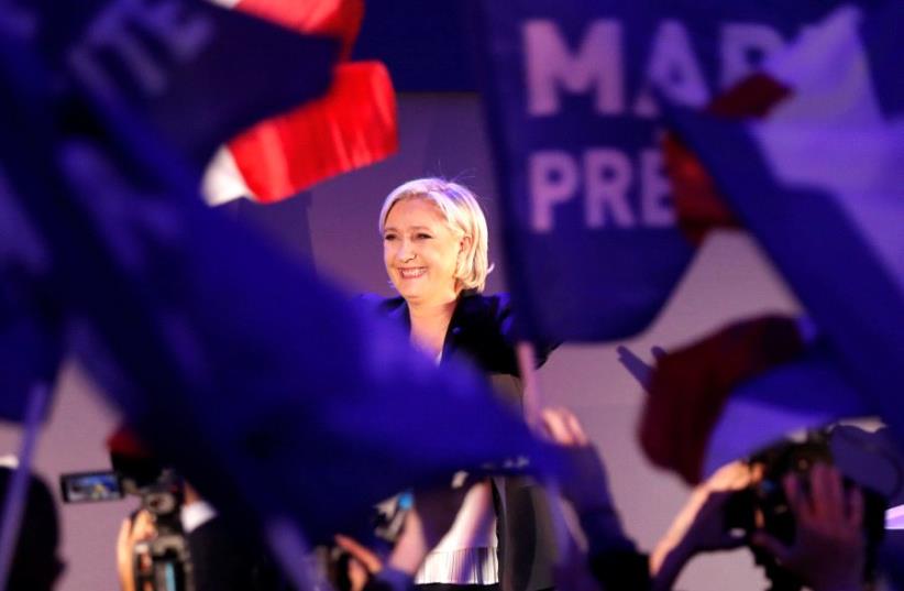 Marine Le Pen, French National Front (FN) political party leader and candidate for French 2017 presidential election, celebrates after early results in the first round of 2017 French presidential election, in Henin-Beaumont, France (photo credit: REUTERS)