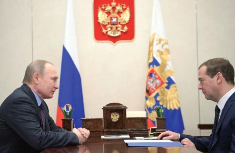 RUSSIA’S PRESIDENT Vladimir Putin meets with Prime Minister Dmitry Medvedev at the Novo-Ogaryovo state residence outside Moscow two weeks ago. (photo credit: REUTERS)