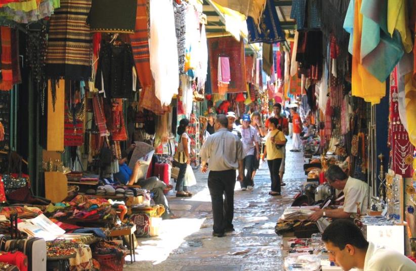 The Arab shuk, which proffers its colorful wares across the Old City’s Muslim and Christian Quarters (photo credit: ESTHER INBAR/WIKIMEDIA COMMONS)