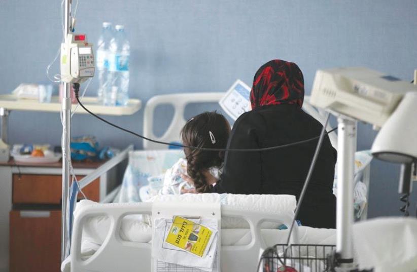 Injured individuals Syrians cares for in Israel (photo credit: REUTERS)