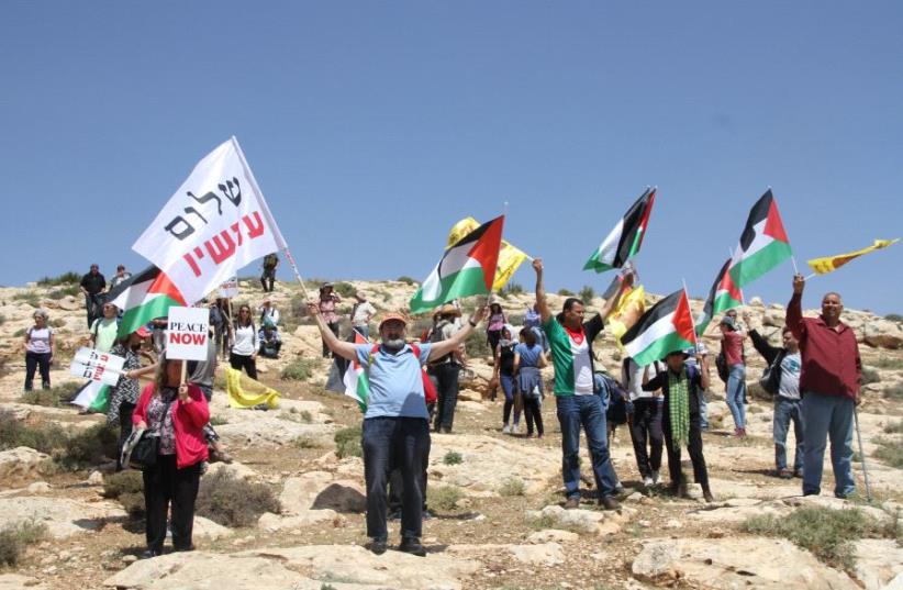 Peace Now demonstration outside of the Kochav HaShahar settlement in the West Bank. (photo credit: TOVAH LAZAROFF)