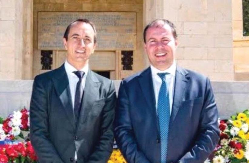 AUSTRALIAN AMBASSADOR Dave Sharma (left) and Josh Frydenberg, Australian minister for environment and energy, at the Commonwealth War Graves Cemetery in Jerusalem where many Jewish Australian and New Zealand soldiers are buried (photo credit: AUSTRALIAN EMBASSY FACEBOOK)