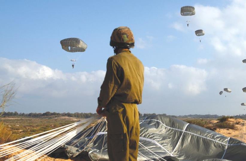 An Israeli paratrooper takes part in a military exercise at the Palmahim air force base (photo credit: REUTERS)