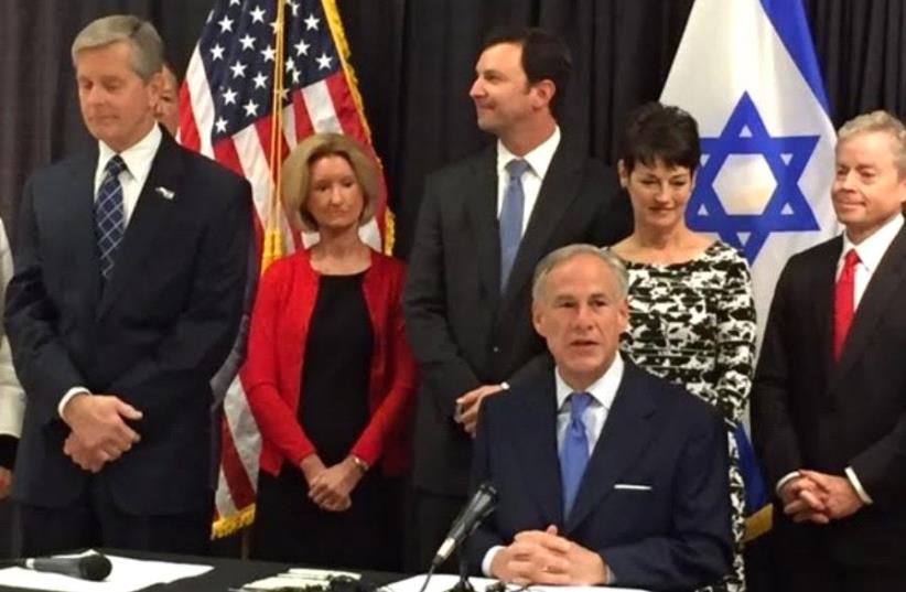 Texas Governor Greg Abbott signs anti-BDS bill into law (photo credit: JENNIFER KAUFMAN)