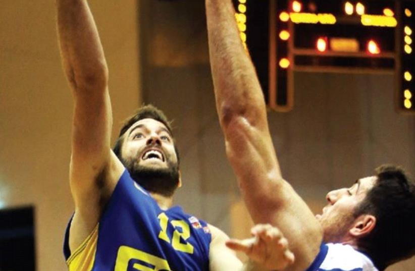 The return from injury of guard Yogev Ohayon (left) has given Maccabi Tel Aviv a timely boost. (photo credit: UDI ZITIAT)