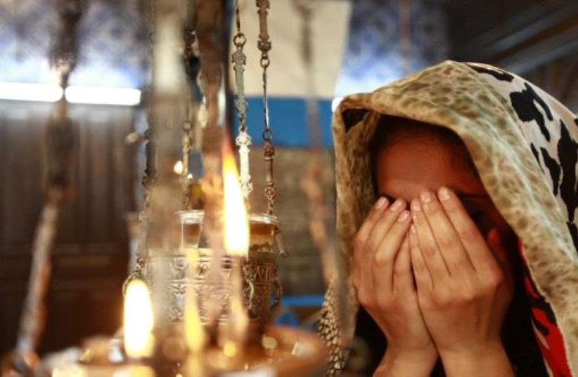 A Jewish worshipper prays during a pilgrimage to the El Ghriba synagogue in Djerba April 28, 2013 (photo credit: REUTERS)