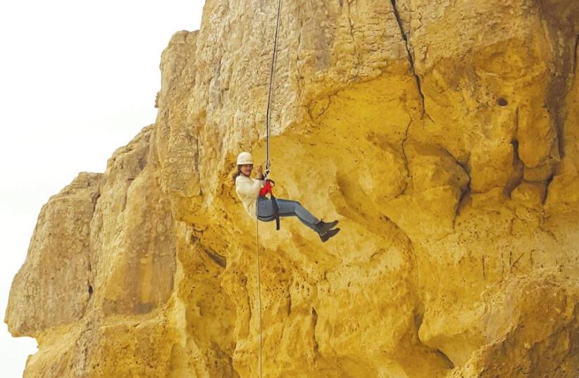 A leap of faith at the rappelling station at the Mitzpe Ramon Visitor Center (photo credit: ELI PECHTER)