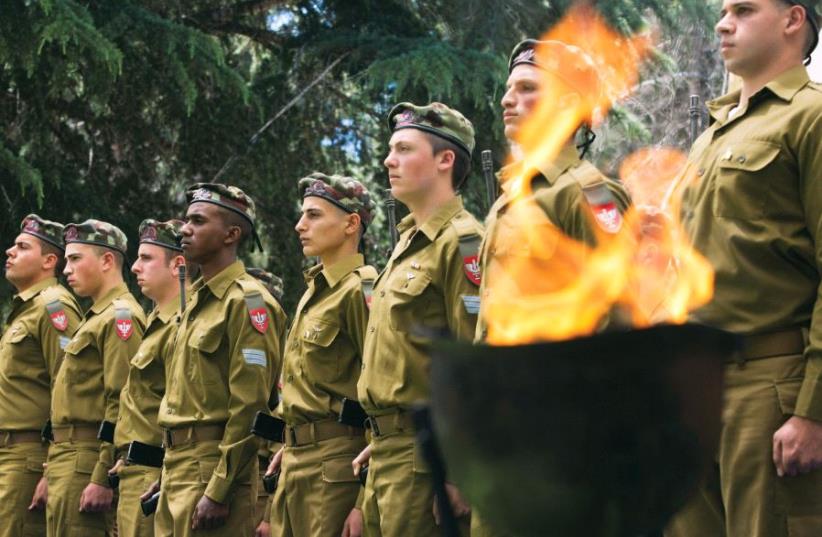 Soldiers attend the Remembrance Day ceremony at Mount Herzl military cemetery in Jerusalem (photo credit: REUTERS)