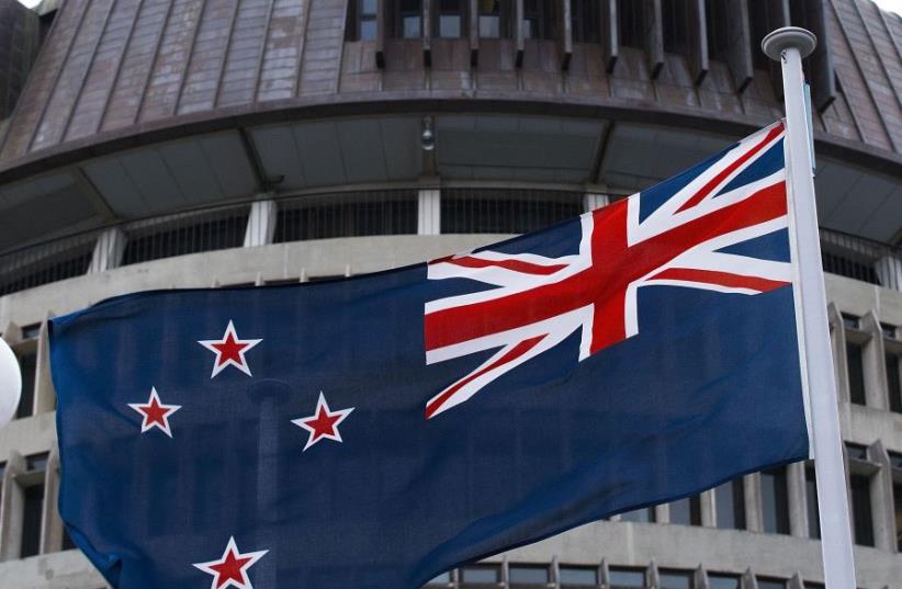 The current New Zealand flag flies on Parliament buildings in Wellington's Central Cusiness District on March 24, 2016. (photo credit: AFP PHOTO)