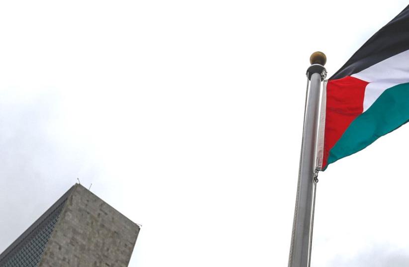 THE PALESTINIAN flag flies next to UN Headquarters in New York (photo credit: REUTERS)