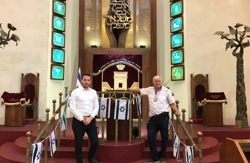The Tel Aviv Great Synagogue’s President Shlomo Pivko (left) and managing director Abraham Eisnberg stand inside the shul. (photo credit: ELIYAHU KAMISHER)