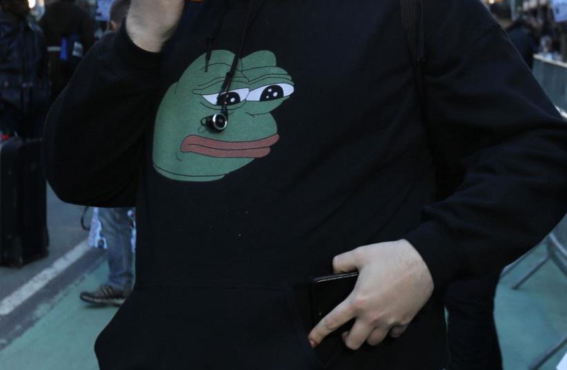 A man wears a Pepe the Frog sweatshirt  (photo credit: REUTERS)