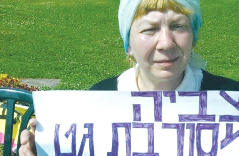 TZVIAH GORDETSKI holds a sign announcing her hunger strike outside the Knesset (photo credit: OFFICE OF MK YAEL COHEN PARAN)
