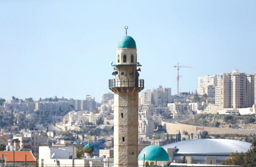 THE MINARET of a mosque is seen in the Arab neighborhood of Beit Safafa in Jerusalem (photo credit: REUTERS)