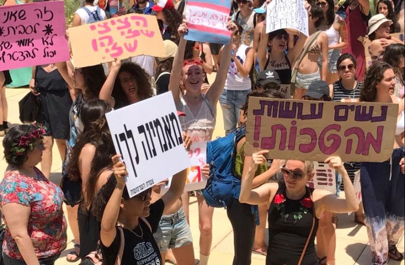 People take part in a "SlutWalk" protest, during which several hundred participants march through the centre of Tel Aviv, May 12, 2017. (photo credit: AVSHALOM SASSONI/MAARIV)
