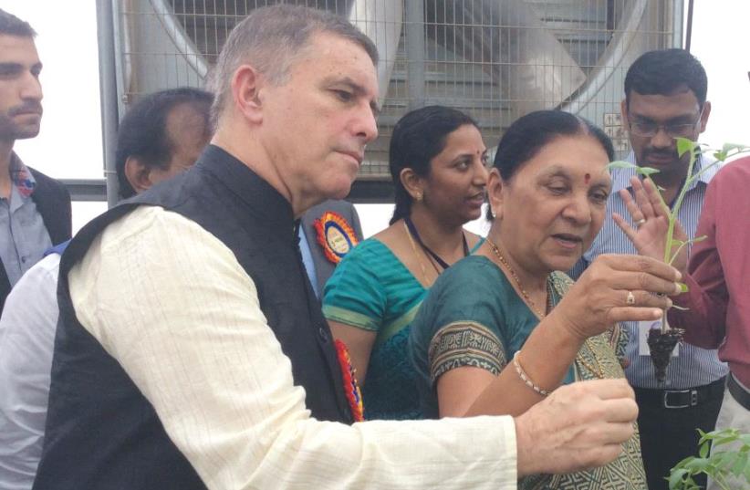 Ambassador Daniel Carmon (left) attends the inauguration of a Center of Excellence in Gujarat, India, with former Gujarat state chief minister Anandiben Patel in 2015 (photo credit: ISRAELI EMBASSY IN NEW DELHI)