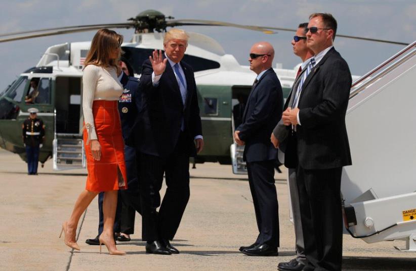 US President Donald Trump and first lady Melania Trump board Air Force One May 19, 2017.  (photo credit: REUTERS / JONATHAN ERNST)