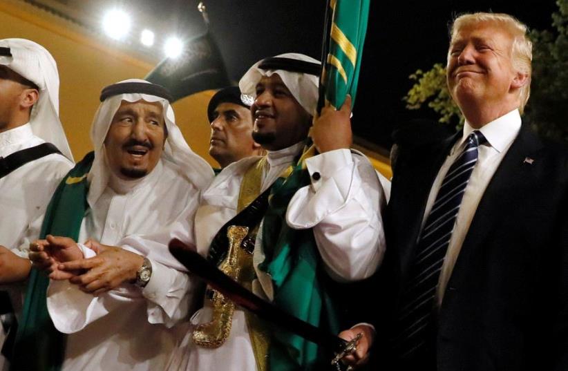 US President Donald Trump pictured dancing with swords at a reception ceremony held in his honor in Saudi Arabia on May 20, 2017.  (photo credit: REUTERS)