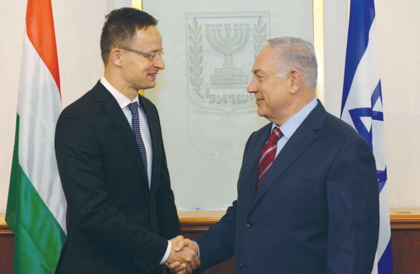 PRIME MINISTER Benjamin Netanyahu meets with Hungary’s Foreign Minister Peter Szijjarto in Jerusalem on Thursday. (photo credit: HAIM ZACH/GPO)