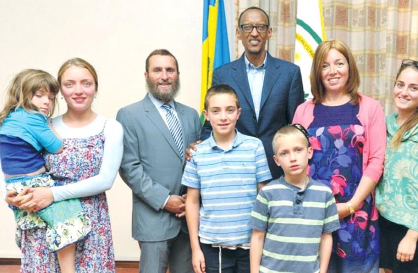 RABBI SHMULEY BOTEACH (center left) and his family meet with Rwandan President Paul Kagame (center) during one of the rabbi’s recent visits to the country. (photo credit: SHMULEY BOTEACH)