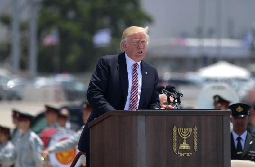 US President Donald Trump speaks during a welcome ceremony upon his arrival at Ben Gurion International Airport in Tel Aviv on May 22, 2017, as part of his first trip overseas (photo credit: MANDEL NGAN / AFP)