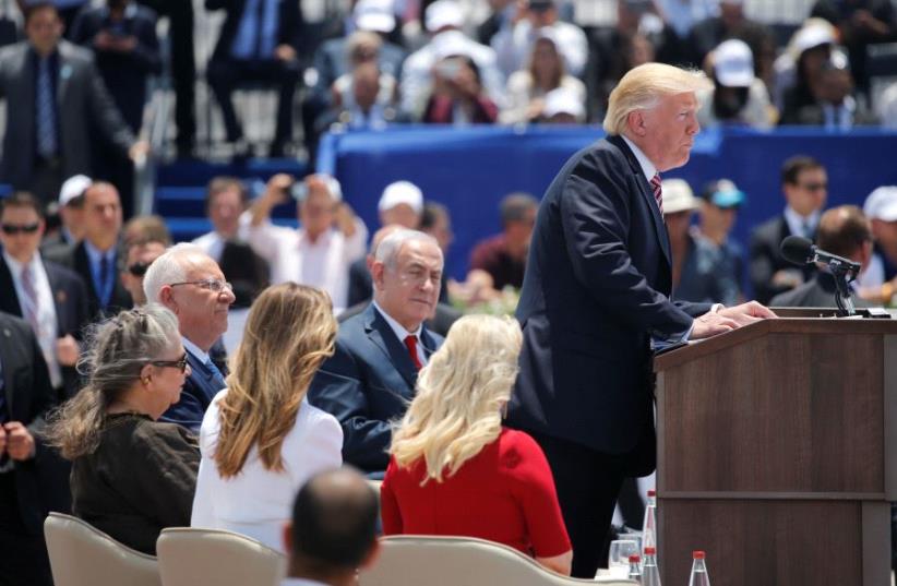US President Donald Trump talks on a podium, upon his arrival at Ben Gurion International Airport in Lod near Tel Aviv, Israel May 22, 2017 (photo credit: REUTERS)