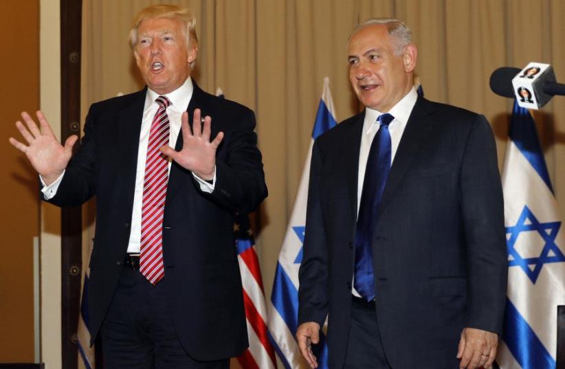 Israel's Prime Minister Benjamin Netanyahu (R) and US President Donald Trump speak with the press in Jerusalem on May 22, 2017. (photo credit: MENAHEM KAHANA / AFP)