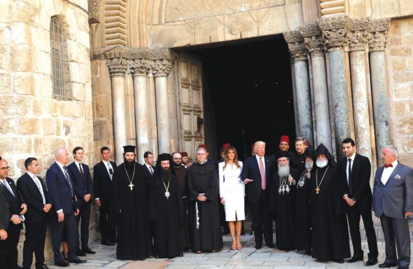 US PRESIDENT Donald Trump and first lady Melania Trump gather with clergy before they tour the Church of the Holy Sepulchre in Jerusalem, May 22 2019 (photo credit: REUTERS)