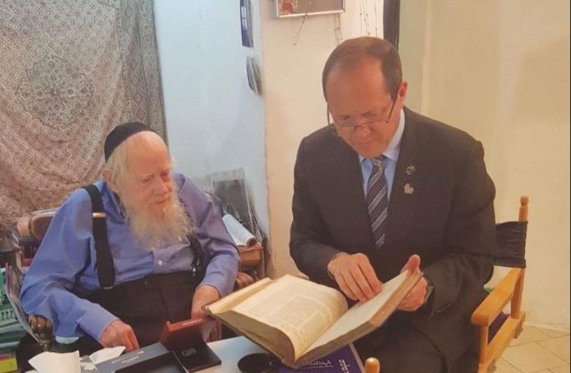 JERUSALEM MAYOR Nir Barkat (right) visits with Rabbi Adin Steinsaltz at his home in the capital’s German Colony neighborhood 22.5.2017. (photo credit: JERUSALEM MUNICIPALITY)