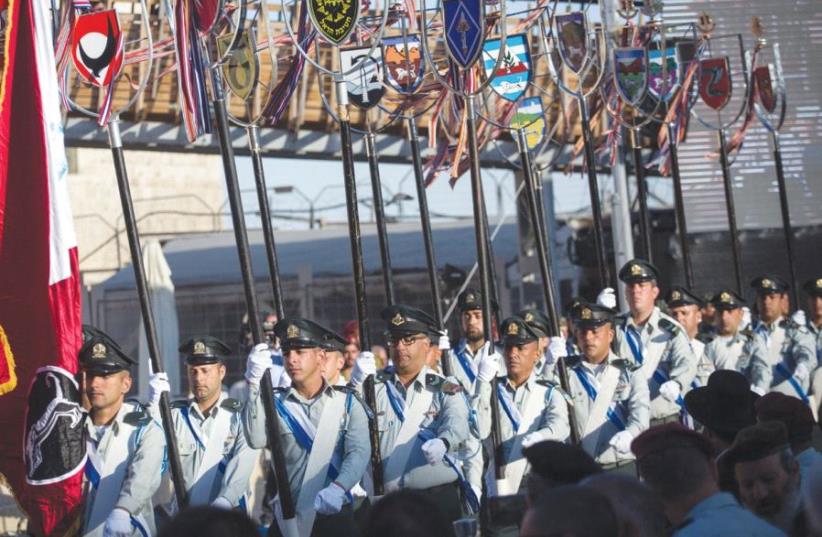 SOLDIERS MARCH during a Jerusalem Day ceremony at the Western Wall in the Old City marking 50 years since the capital’s reunification in the 1967 Six Day War. (photo credit: HADAS PARUSH/FLASH90)