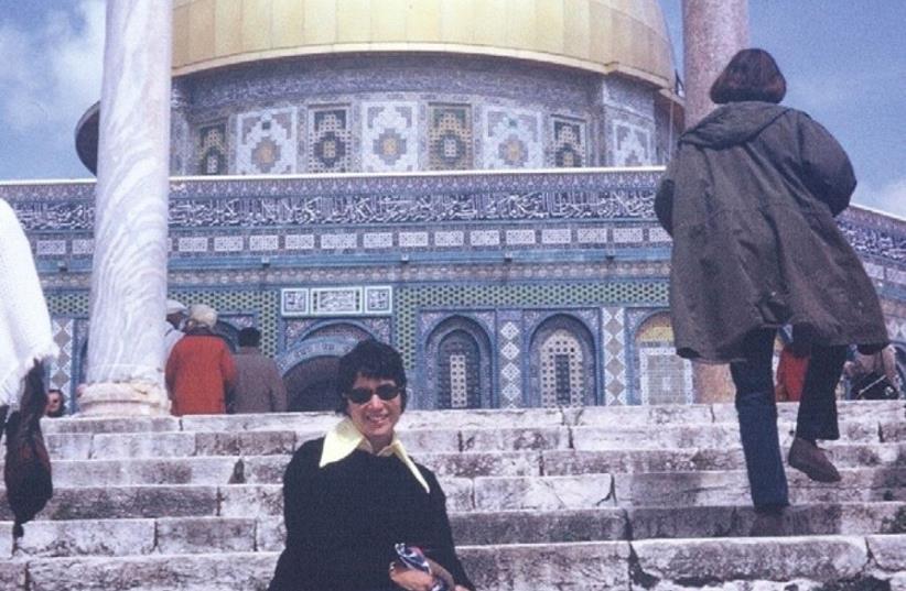 Rita Geffen sits on the steps leading up to Jerusalem’s Dome of the Rock, located opposite the southern courtyard of the Church of the Holy Sepulchre, in 1971 (photo credit: AVIE GEFFEN)