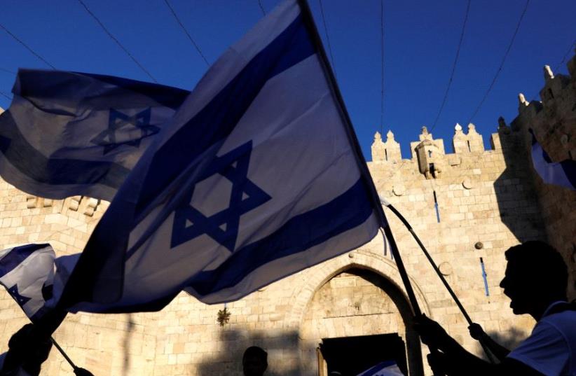 Israeli flags in front of Damascus Gate (photo credit: REUTERS)