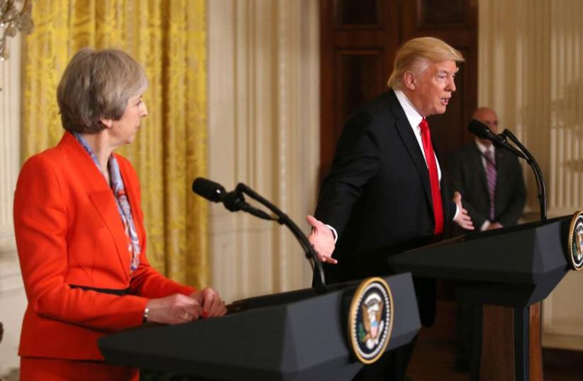 British Prime Minister Theresa May looks on as US President Donald Trump speaks during their joint news conference at the White House in Washington, January 27, 2017 (photo credit: REUTERS)