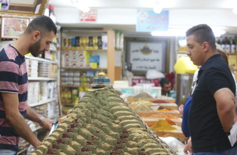 Muslim residents of Jerusalem’s Old City prepare on Thursday for Ramadan, which begins today. (photo credit: MARC ISRAEL SELLEM/THE JERUSALEM POST)