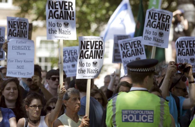 People of multiple faiths hold a counter-protest to an anti-Shomrim protest that was held to demonstrate against Britain's Jewish community in Westminster, London, Britain, July 4, 2015 (photo credit: REUTERS/PETER NICHOLLS)