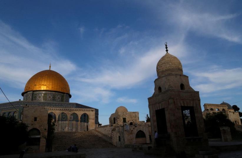 The Dome of the Rock is seen during sunset on the compound known to Muslims as al-Haram al-Sharif and to Jews as Temple Mount in Jerusalem's Old City (photo credit: REUTERS/AMMAR AWAD)