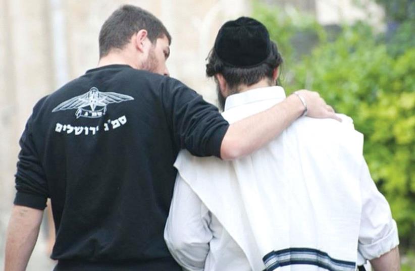 A secular and religious Jew walk arm in arm as a celebration of Jewish unity (photo credit: KAREN ABRAMSON)