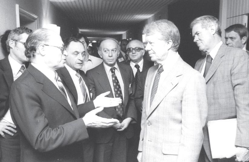 US President Jimmy Carter (right) and prime minister Menachem Begin meet at the King David Hotel in Jerusalem in March 1979 (photo credit: YAACOV SAAR/GPO)