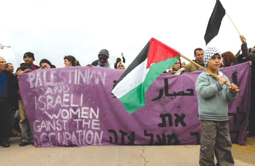 PRO-PALESTINIAN ACTIVISTS protest near the Erez Crossing in 2008. (photo credit: REUTERS)