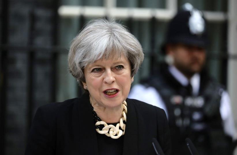 Britain's Prime Minister Theresa May speaks outside 10 Downing Street after an attack on London Bridge and Borough Market left 7 people dead and dozens injured in London, Britain, June 4, 2017. (photo credit: REUTERS/KEVIN COOMBS)